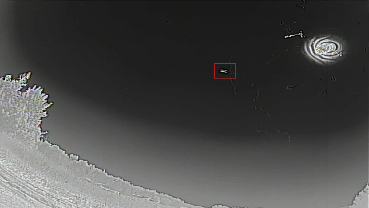 Thermal camera view showing drone detection with target lock